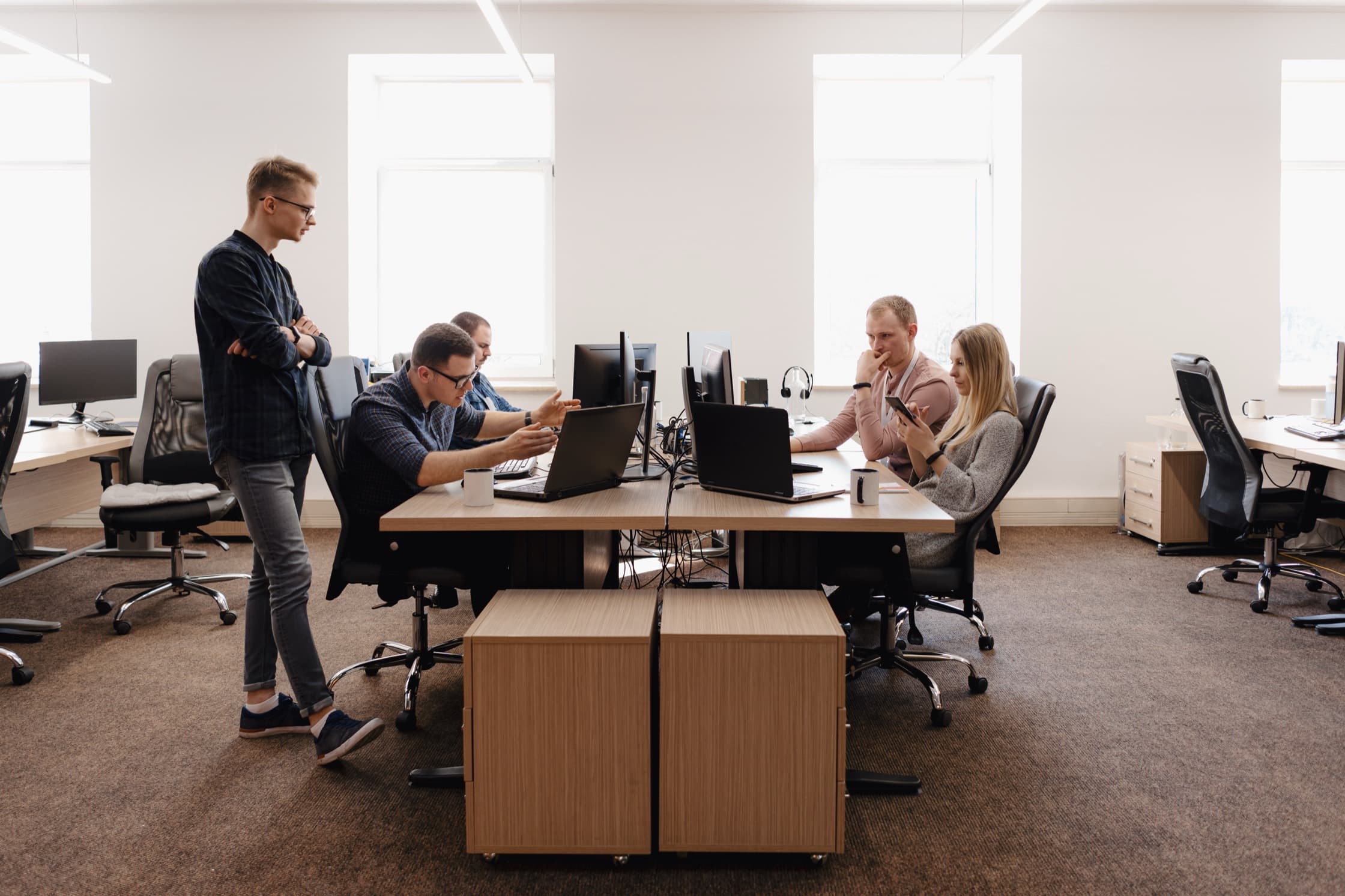 The Fleet & Miles team working together in the office